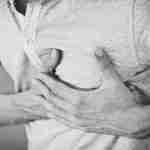 Chest Injury Claim Man holding his chest following an impact injury