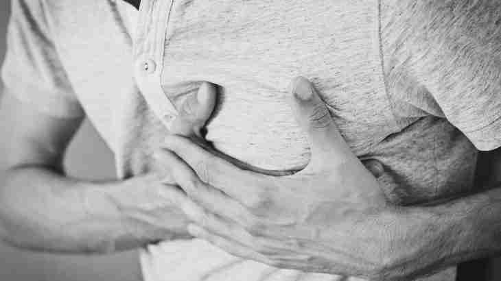 Man holding his chest following an impact injury
