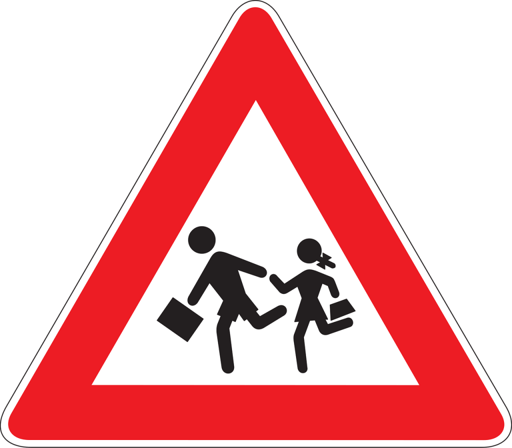 child school crossing road warning sign
