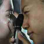 Eye Injury Claim Eye specialist examining a patient’s eye injury with medical equipment