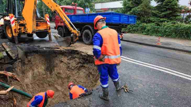 Unsecured roadworks with a deep trench creating a hazard on a public highway