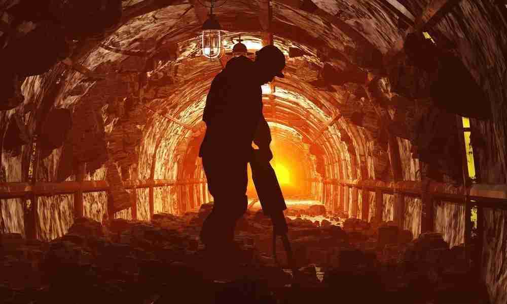 Work Related Disease Compensation Questions miner drilling in a tunnel in excessive heat surrounded by dust contemplating a claim for work related disease